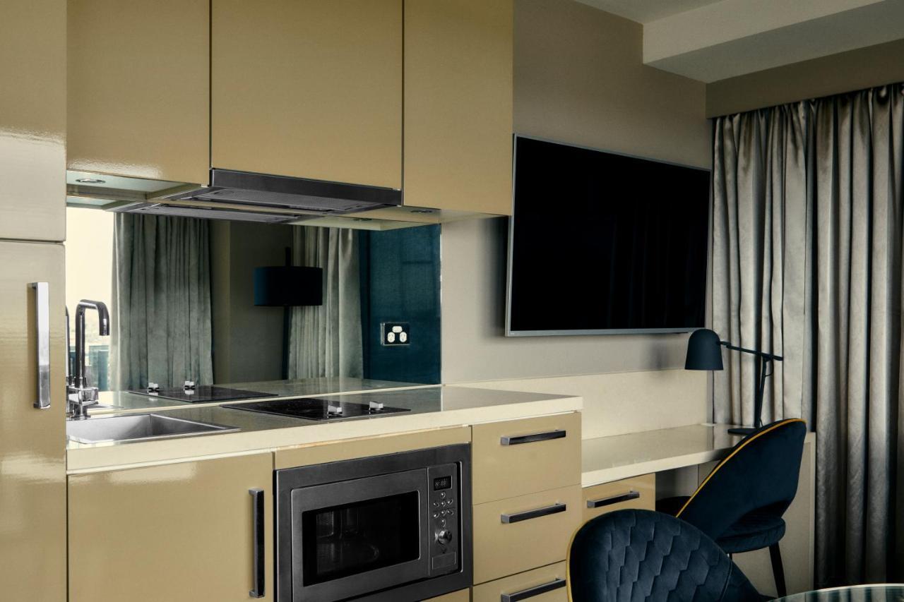 Hotel The Kinson Melbourne City Exterior foto A kitchen in a serviced apartment